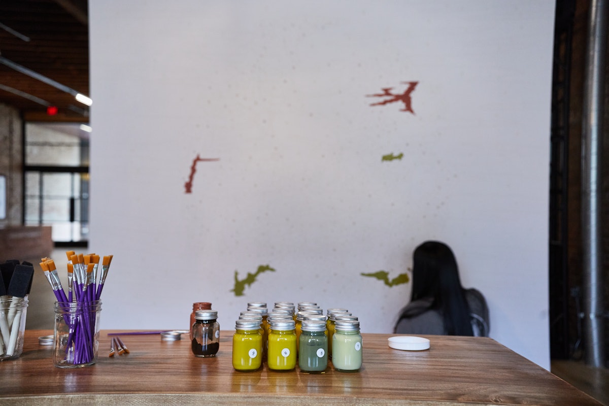 Fans painting the 8-foot paint by number mural of the Subtract album cover at one of five pop-up cities