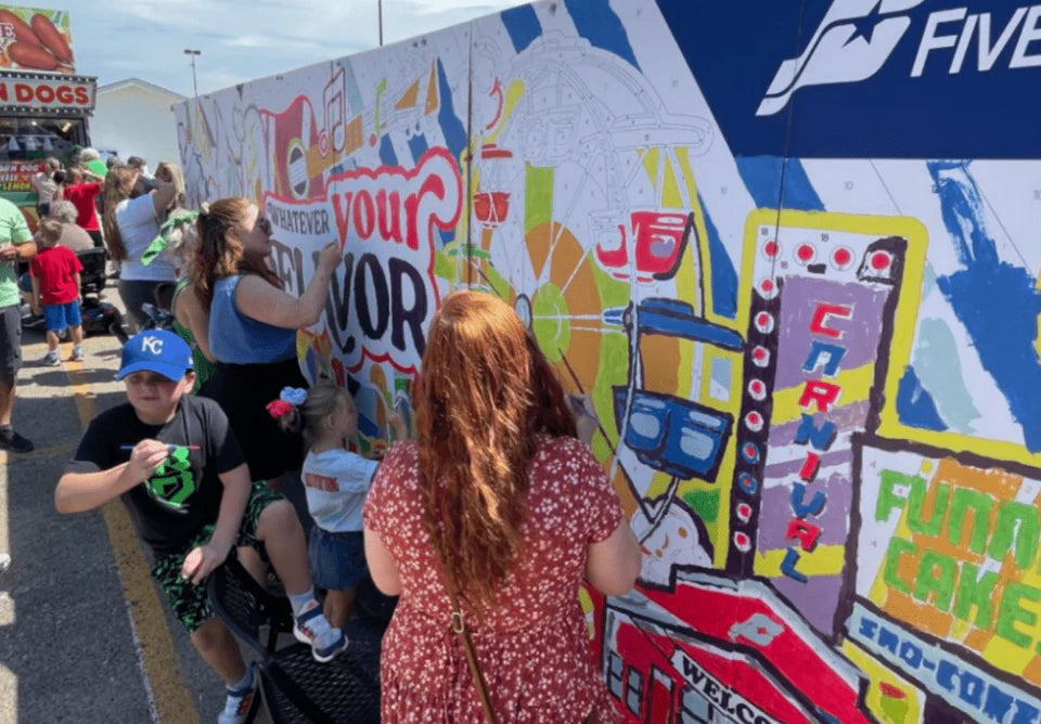 Paint by number mural at a large outdoor brand activation festival